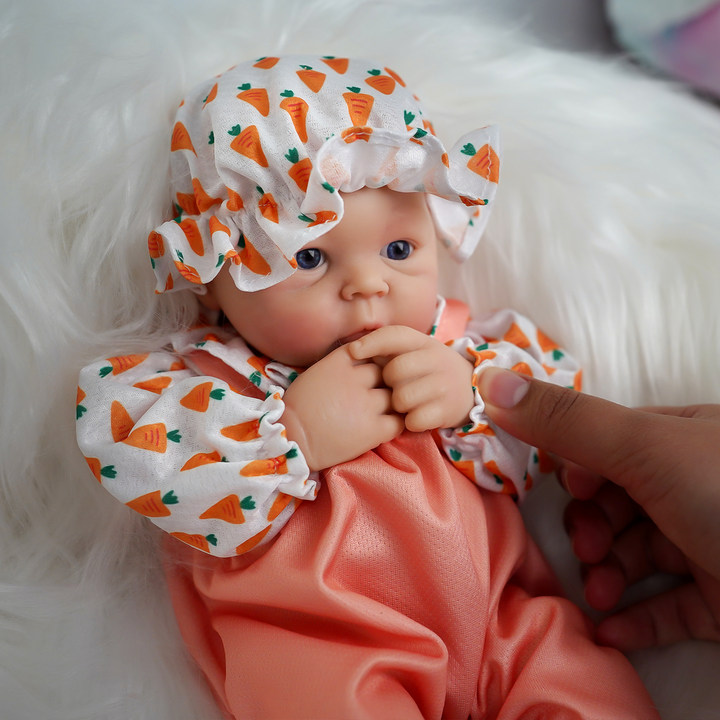 Muñeca bebé de silicona de cue - Kids Educational Songs reseña y precio