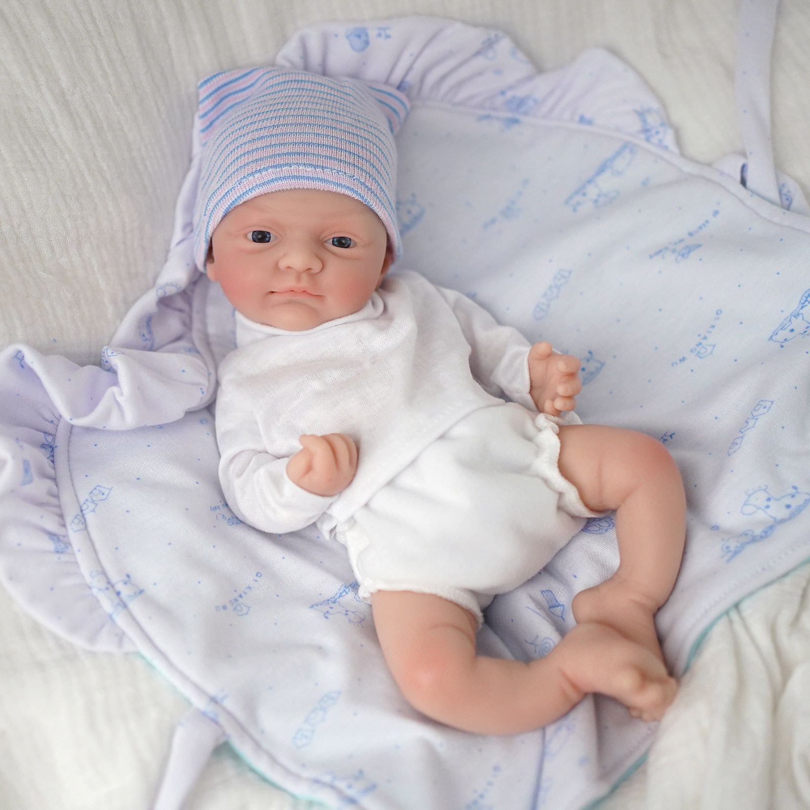 Muñeca bebé de silicona de cue - Kids Educational Songs reseña y precio